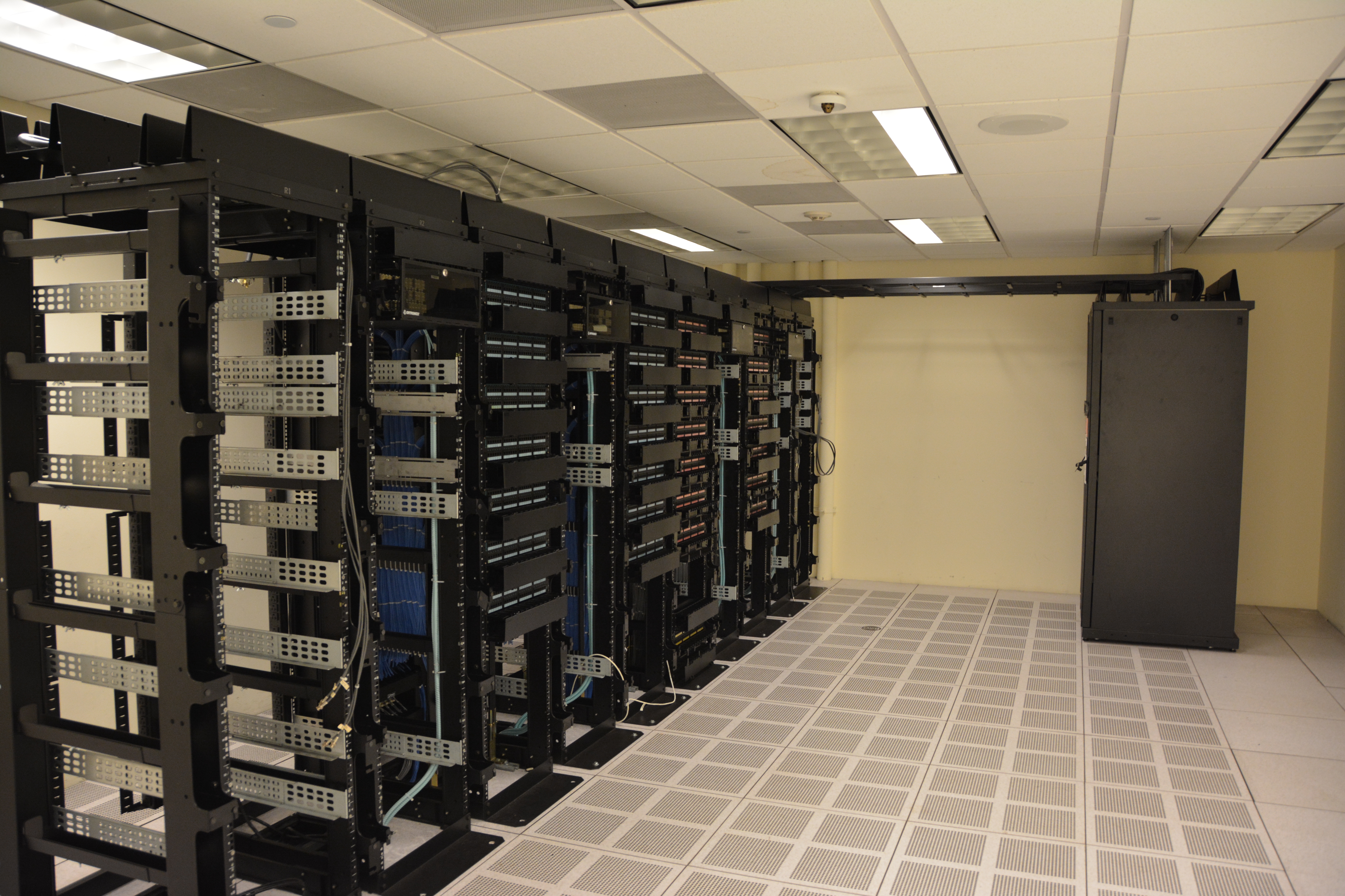 Rows of server racks in a data center, illustrating web hosting infrastructure